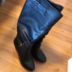 Black heeled knee high boots